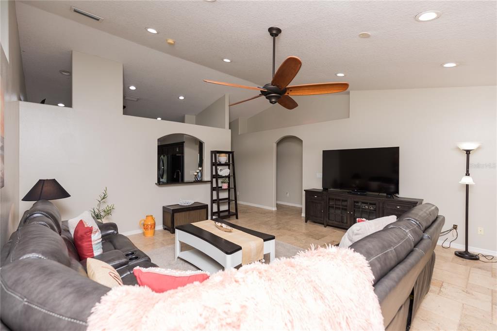 7 Lancaster Lane Palm Coast, FL 32137 - Photo 28 of 67 a living room with furniture and a flat screen tv