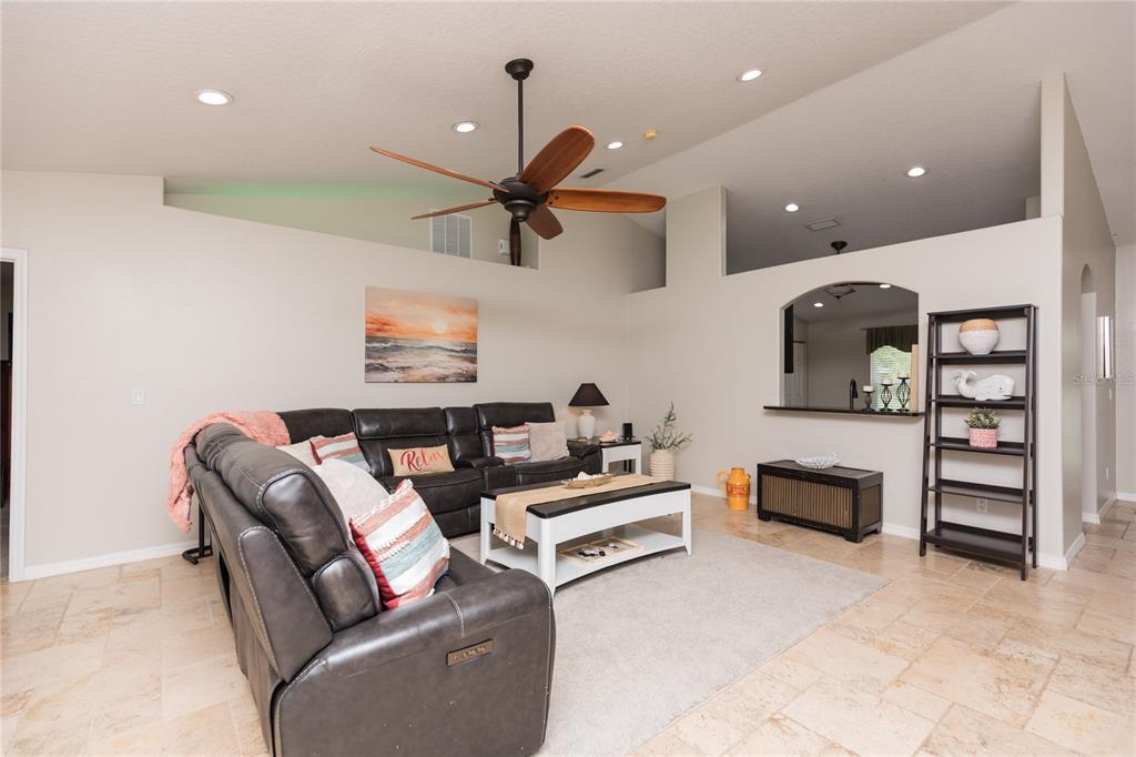 7 Lancaster Lane Palm Coast, FL 32137 - Photo 30 of 67 a living room with furniture and a ceiling fan