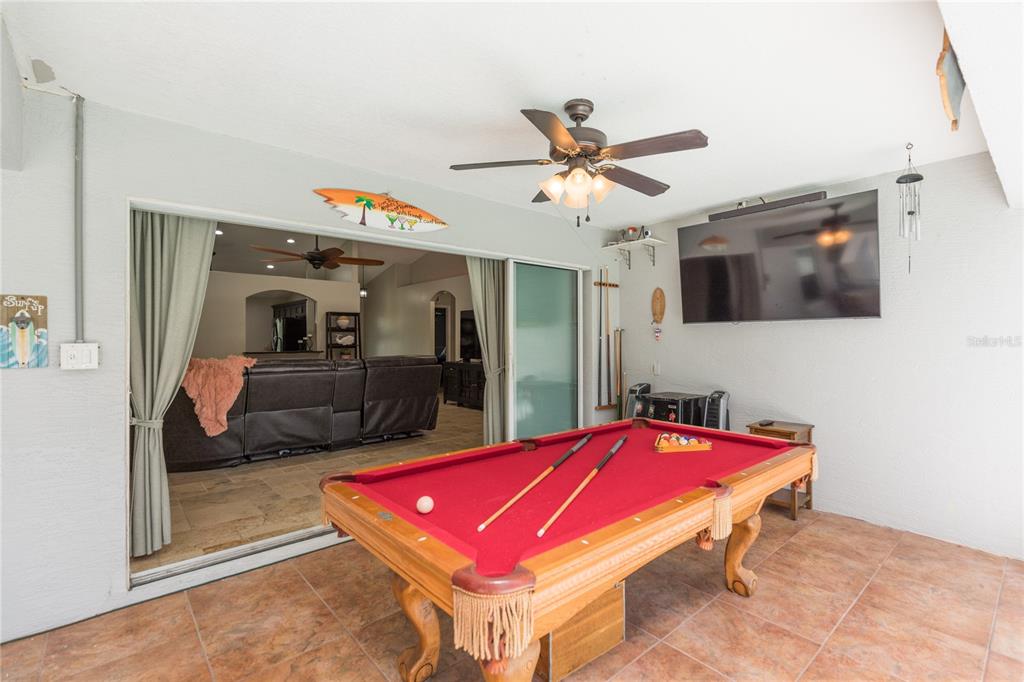 7 Lancaster Lane Palm Coast, FL 32137 - Photo 33 of 67 a room with pool table and flat screen tv