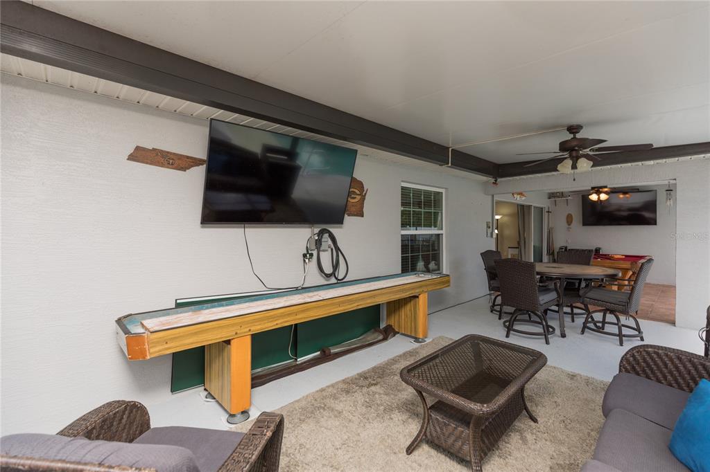 7 Lancaster Lane Palm Coast, FL 32137 - Photo 38 of 67 a living room with furniture and a flat screen tv