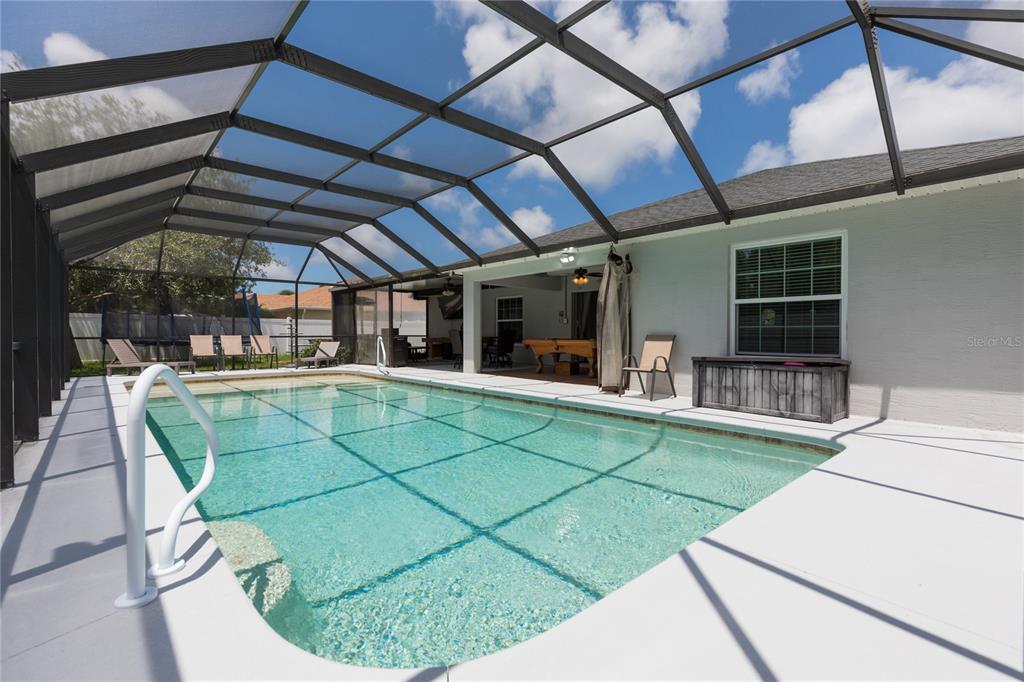 7 Lancaster Lane Palm Coast, FL 32137 - Photo 42 of 67 a view of a swimming pool with a patio