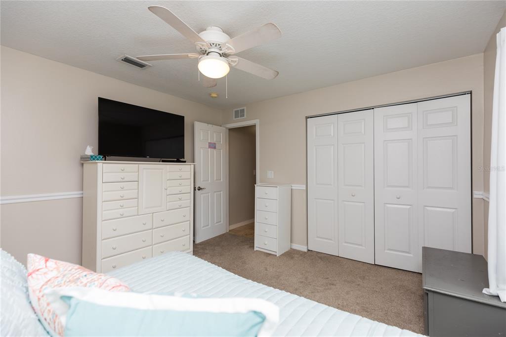 7 Lancaster Lane Palm Coast, FL 32137 - Photo 59 of 67 a living room with furniture and a flat screen tv
