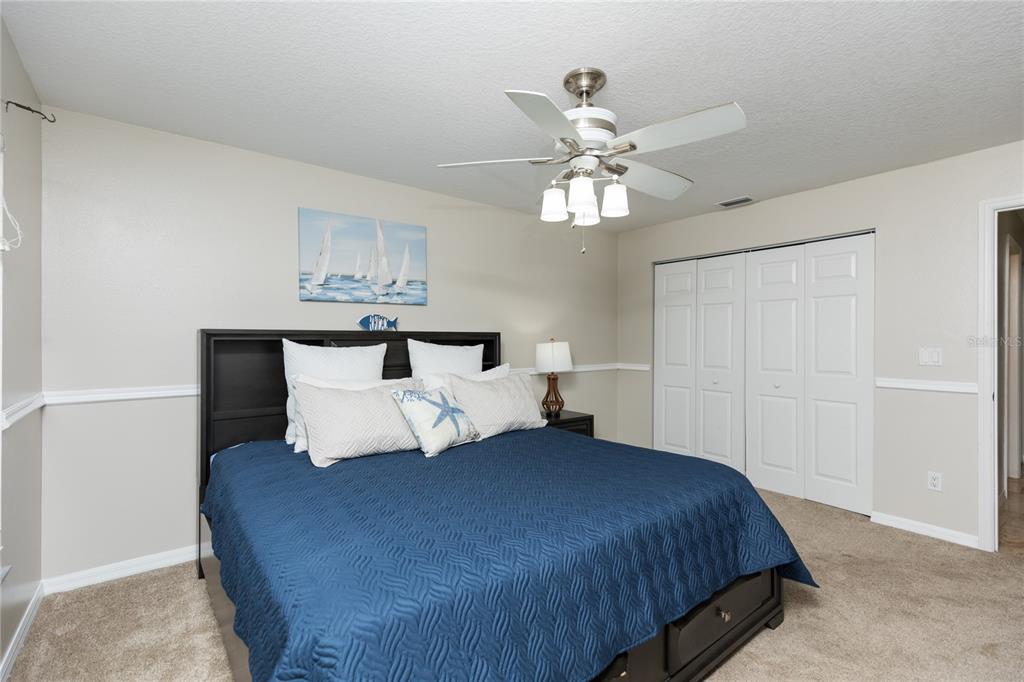7 Lancaster Lane Palm Coast, FL 32137 - Photo 63 of 67 a bedroom with a bed and window