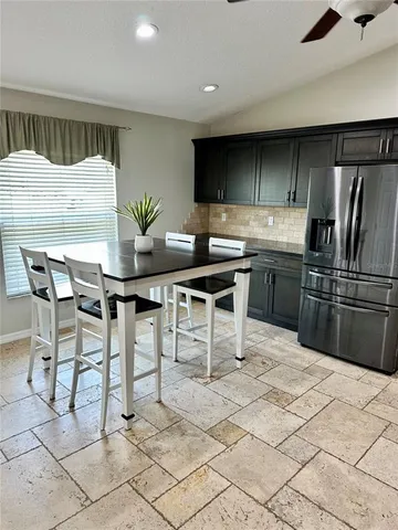 a bed room with a bed and a lamp