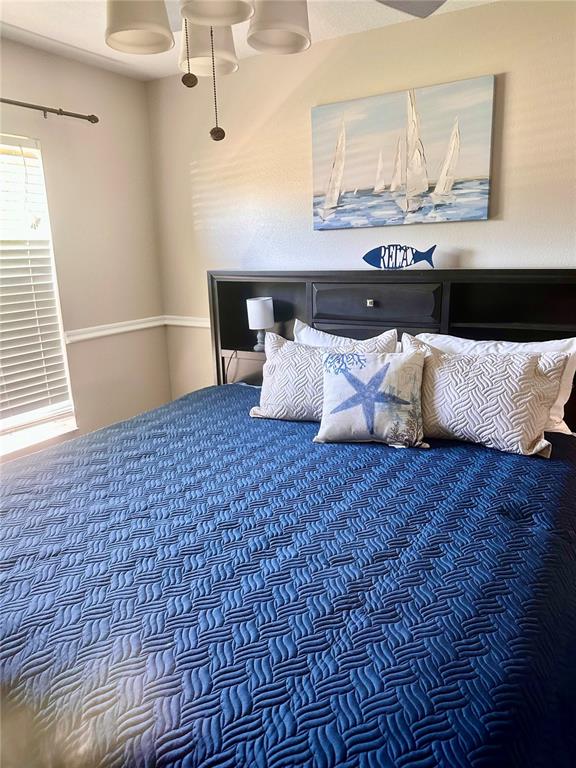 7 Lancaster Lane Palm Coast, FL 32137 - Photo 10 of 67 a bedroom with a bed and wooden floor