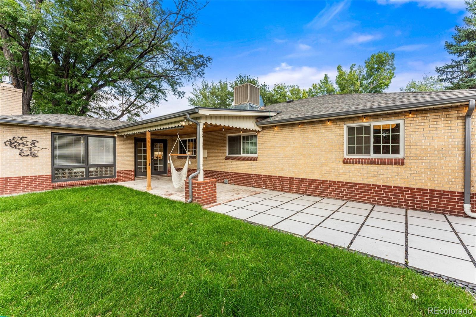 3715 Fenton Street Wheat Ridge, CO 80212 - Photo 12 of 13 a view of a house with a backyard