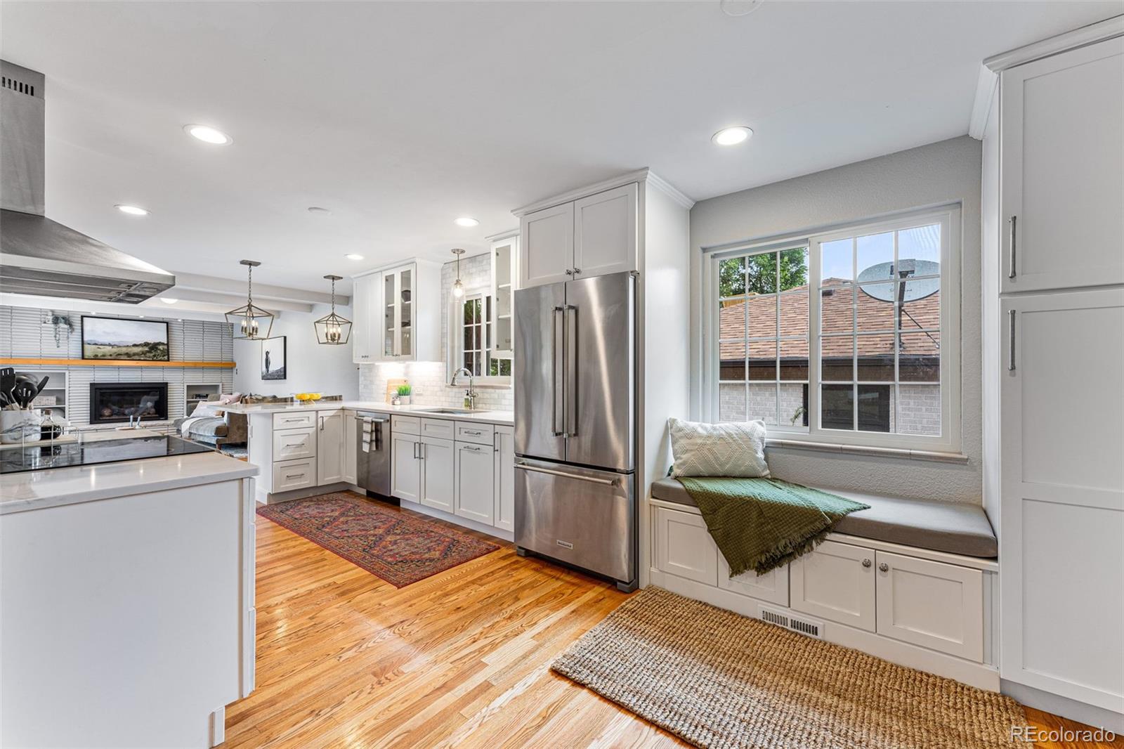 3715 Fenton Street Wheat Ridge, CO 80212 - Photo 2 of 13 a kitchen with stainless steel appliances granite countertop a refrigerator and a stove top oven