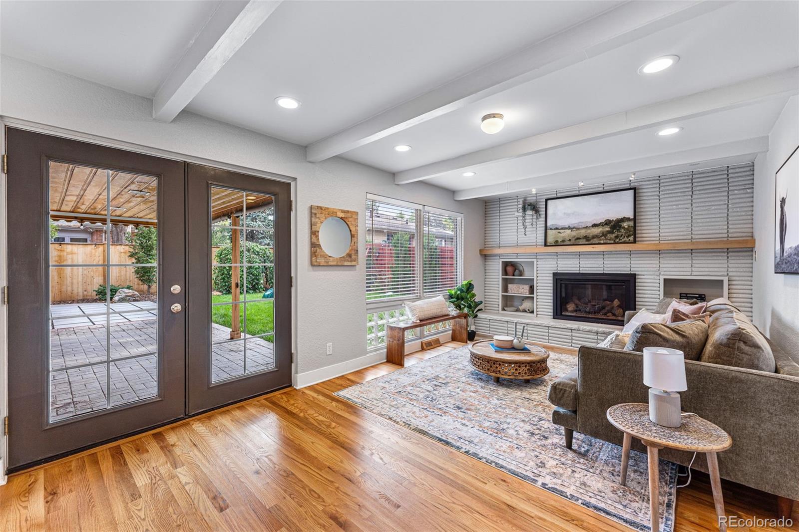 3715 Fenton Street Wheat Ridge, CO 80212 - Photo 3 of 13 a living room with furniture and a fireplace
