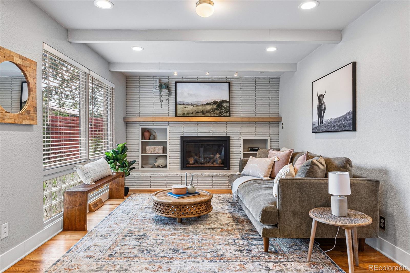 3715 Fenton Street Wheat Ridge, CO 80212 - Photo 4 of 13 a living room with furniture and a fireplace