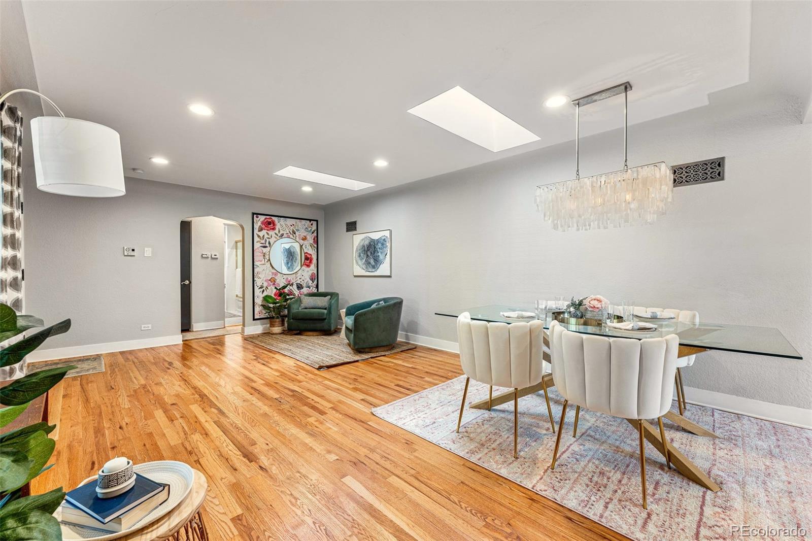 3715 Fenton Street Wheat Ridge, CO 80212 - Photo 5 of 13 a living room with furniture and a wooden floor