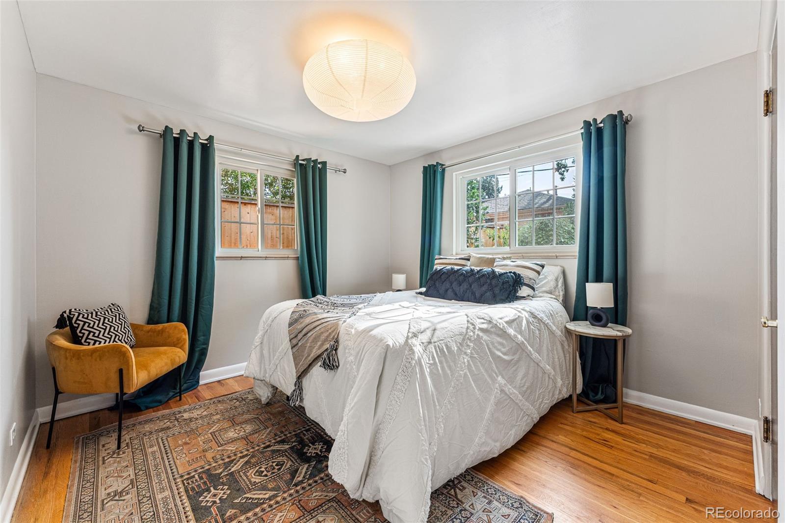 3715 Fenton Street Wheat Ridge, CO 80212 - Photo 9 of 13 a bedroom with a bed and window