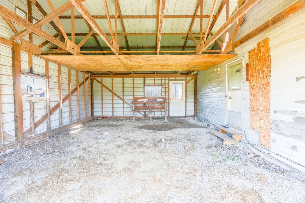 752 Stuart Chapel Road Lewisburg, KY 42256 - Photo 15 of 33 a view of empty room with wooden floor and door