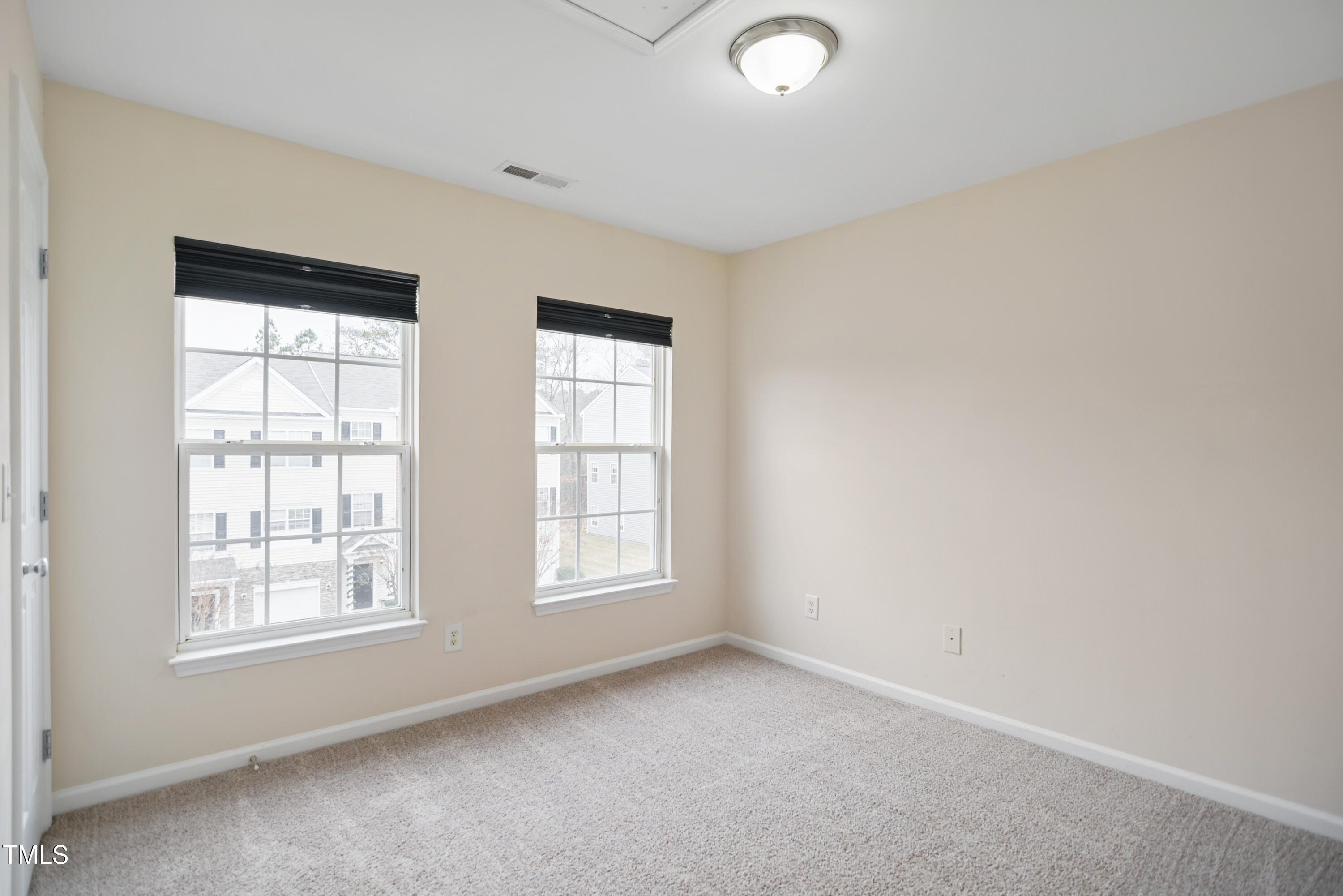 1673 Snow Mass Way Durham, NC 27713 - Photo 17 of 20 an empty room with windows