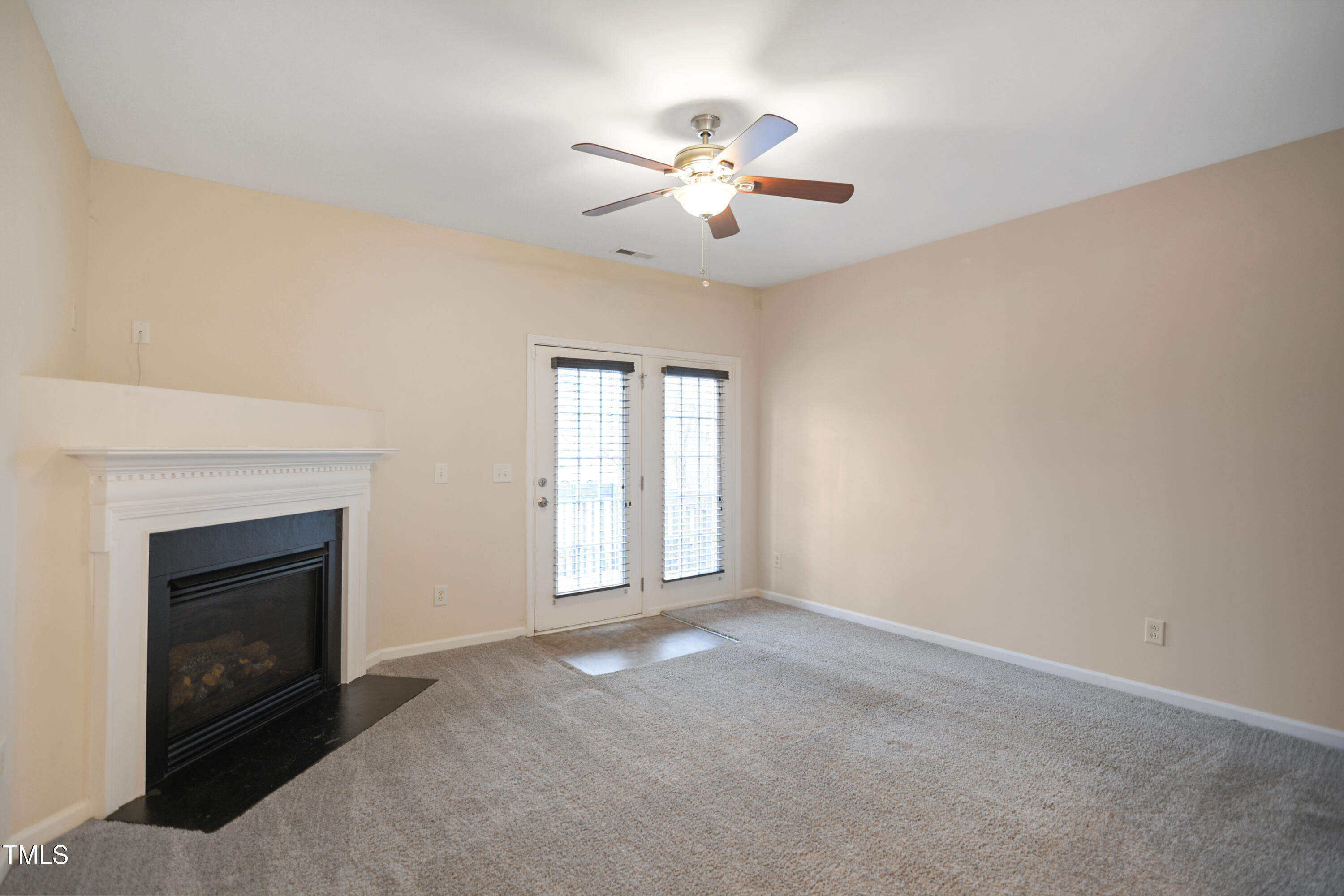 1673 Snow Mass Way Durham, NC 27713 - Photo 2 of 20 a view of an empty room with chandelier fan and fire place