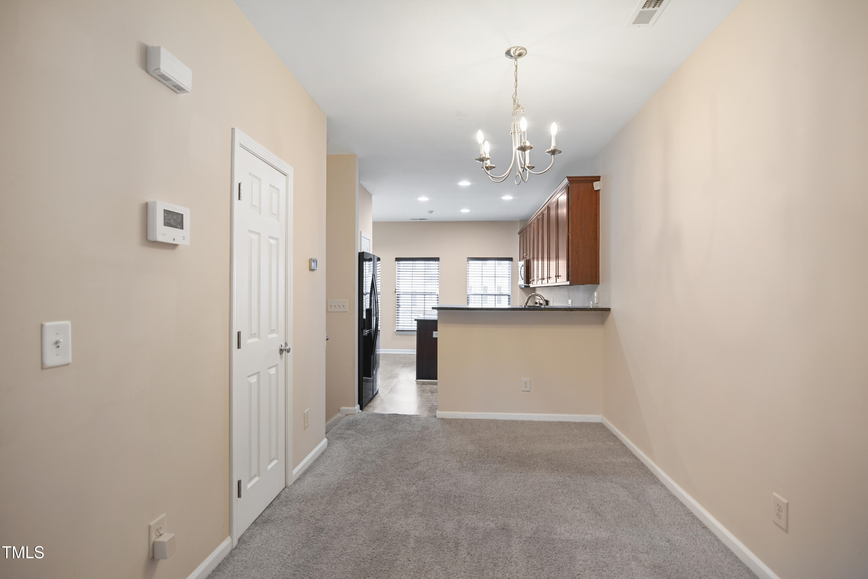 1673 Snow Mass Way Durham, NC 27713 - Photo 5 of 20 a view of a kitchen and an entryway