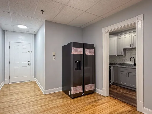 a kitchen with granite countertop a stove and a sink