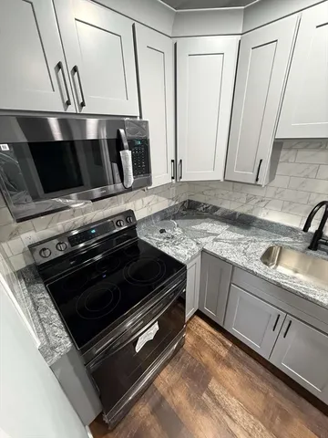 a view of a livingroom with wooden floor