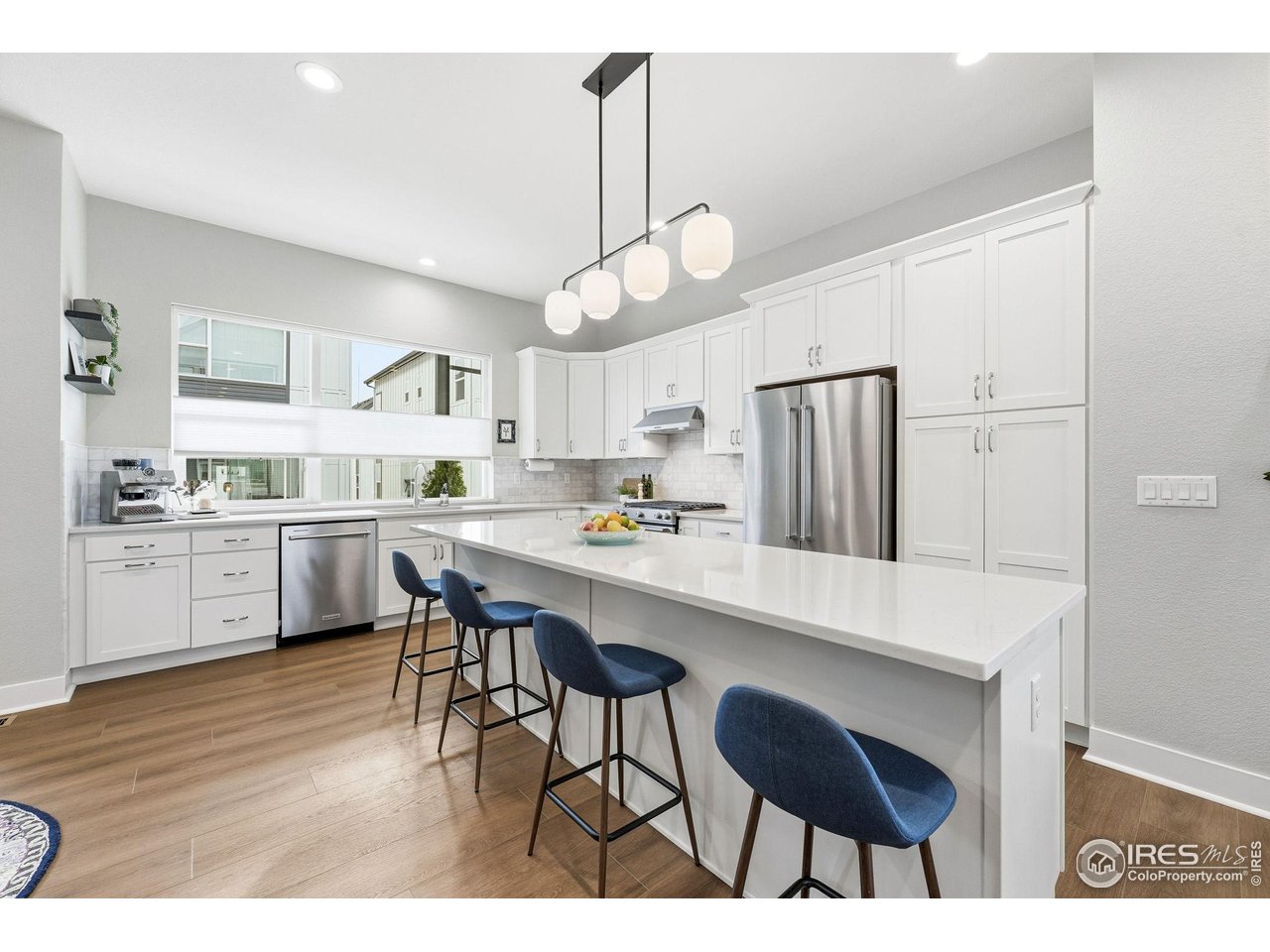 5189 Vivian Street Wheat Ridge, CO 80033 - Photo 15 of 39 Generous island with seating