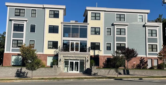 a front view of a building with street view