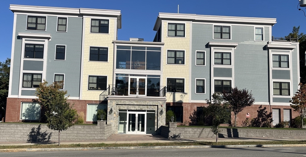 a front view of a building with street view