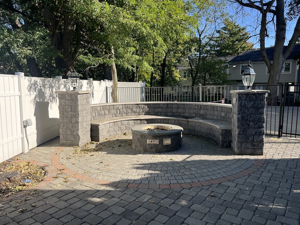 45 Spring Street, Unit 6 Boston, MA 02132 - Photo 15 of 17 a view of a back yard of the house