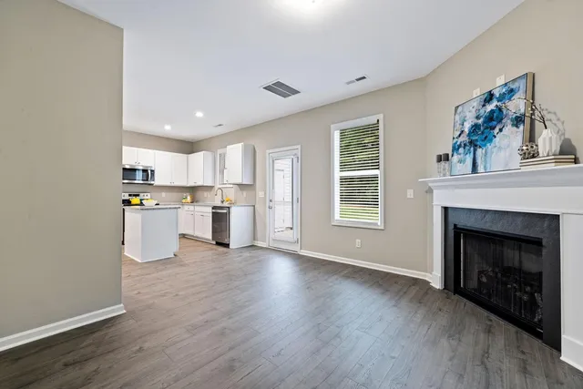 a view of a kitchen with furniture and a fireplace