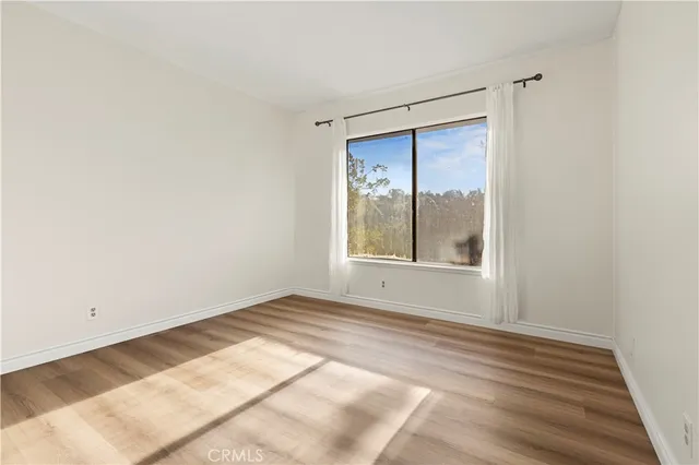 a bathroom with a granite countertop double vanity sink and mirror