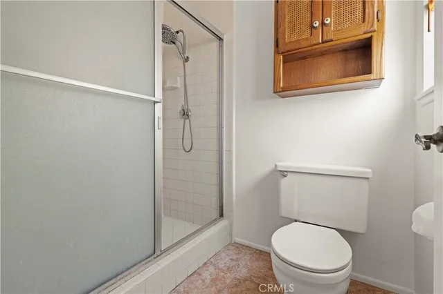 a view of a porch with a table and chairs