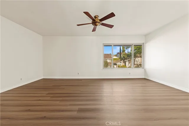 a front view of a house with a garden and sitting area