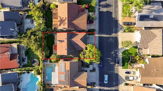 an aerial view of residential houses with outdoor space