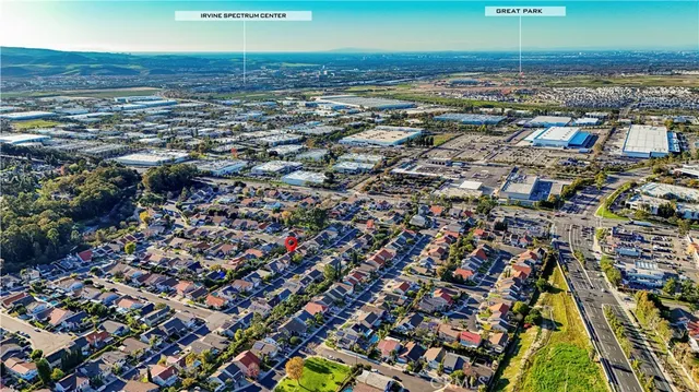 an aerial view of residential houses with outdoor space
