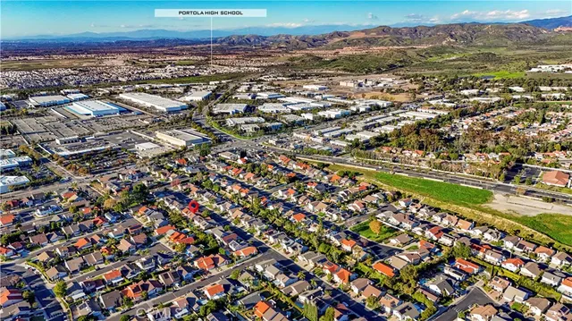 an aerial view of a house a yard and outdoor seating