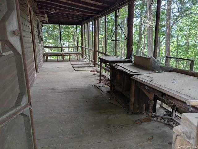 131 Old Plank Road Sparrowbush, NY 12780 - Photo 13 of 19 a view of a patio with a table chairs and a backyard