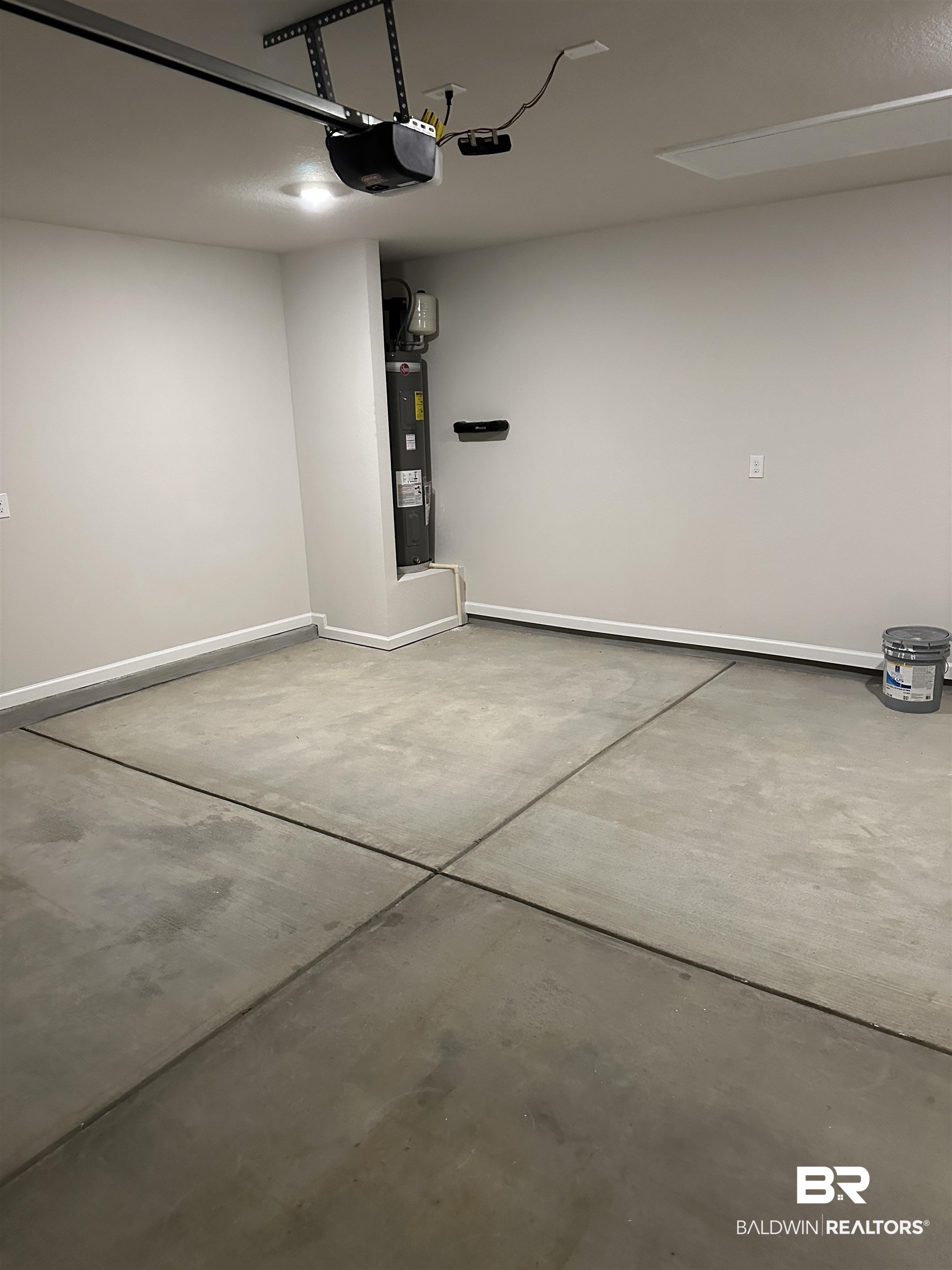 8850 Sea Star Circle Foley, AL 36535 - Photo 12 of 29 Garage with water heater and a garage door opener