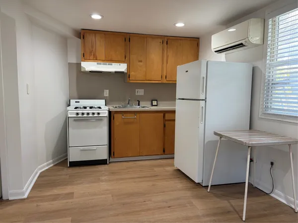 a kitchen with stainless steel appliances a refrigerator stove microwave and cabinets