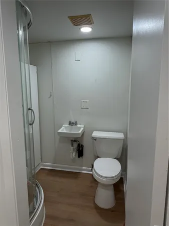 a bathroom with a toilet and a sink