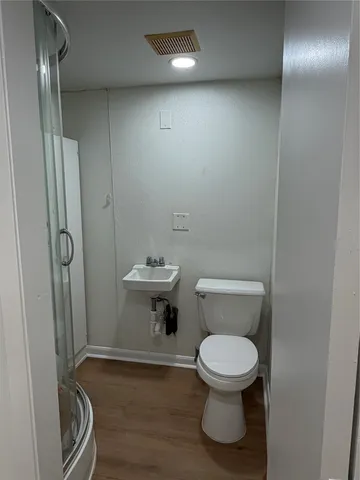 a bathroom with a toilet and a sink