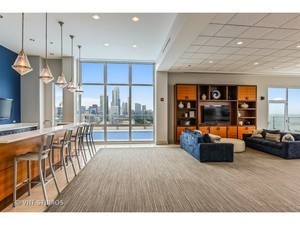1629 South Prairie Avenue, Unit 2906 Chicago, IL 60616 - Photo 16 of 21 a living room with furniture and a large window