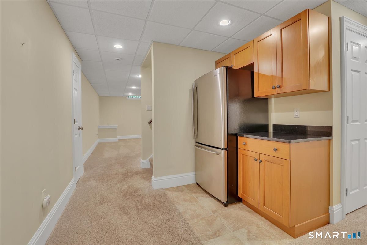 24 Red Fox Run Canton, CT 06019 - Photo 31 of 40 Bar area of lower level (refrigerator included)