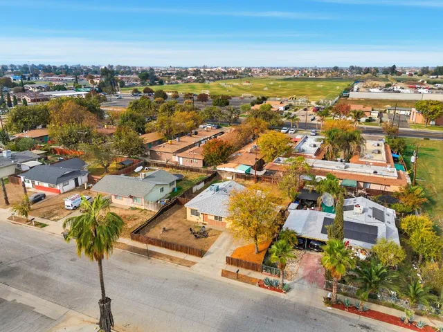 an aerial view of residential building with parking space
