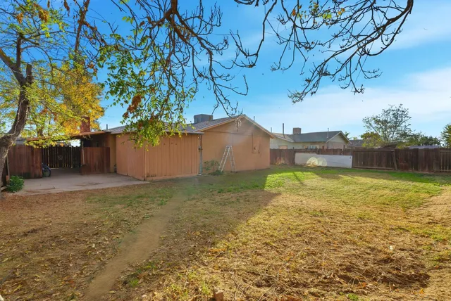 a backyard of a house with lots of green space