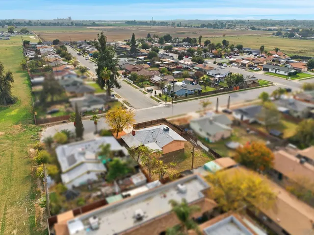 an aerial view of a city with lake view