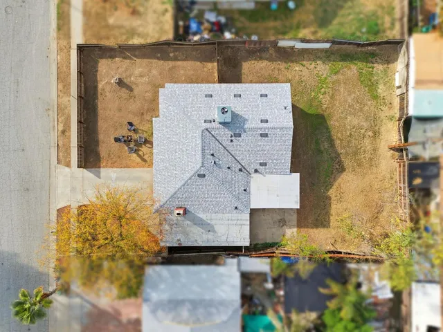 an aerial view of a house with a garden