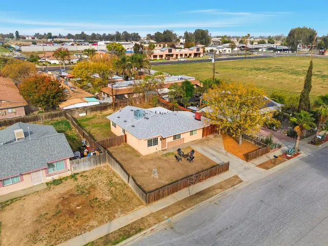 an aerial view of a house with a ocean view