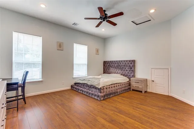 a bedroom with a bed and a chair