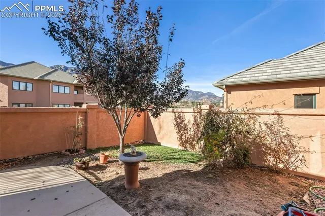 a view of a backyard with sitting area