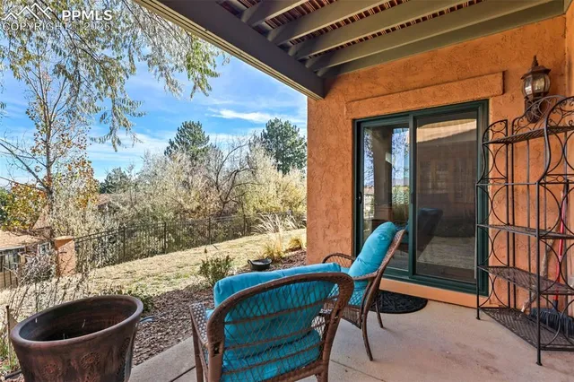 a view of an outdoor sitting area with furniture and wooden floor