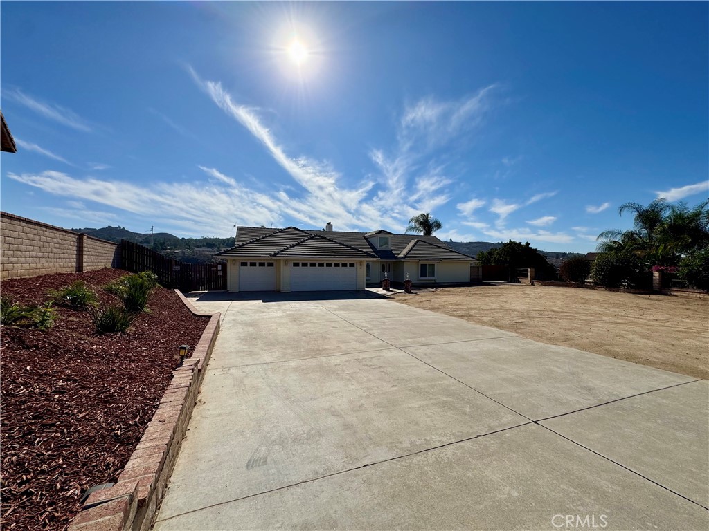15605 Terraceview Court Riverside, CA 92504 - Photo 1 of 1 a view of a couches under an umbrella