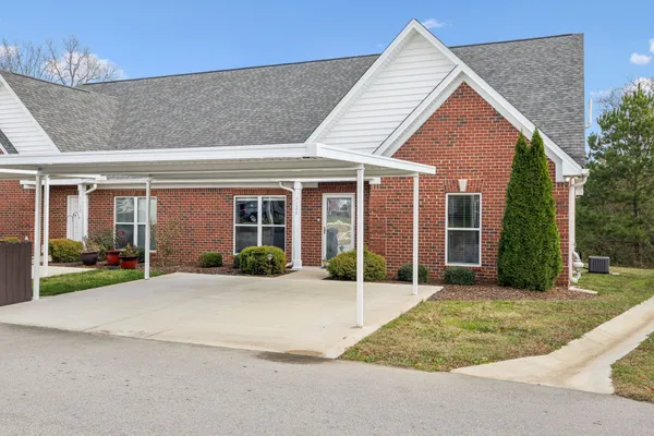 front view of a house with a patio