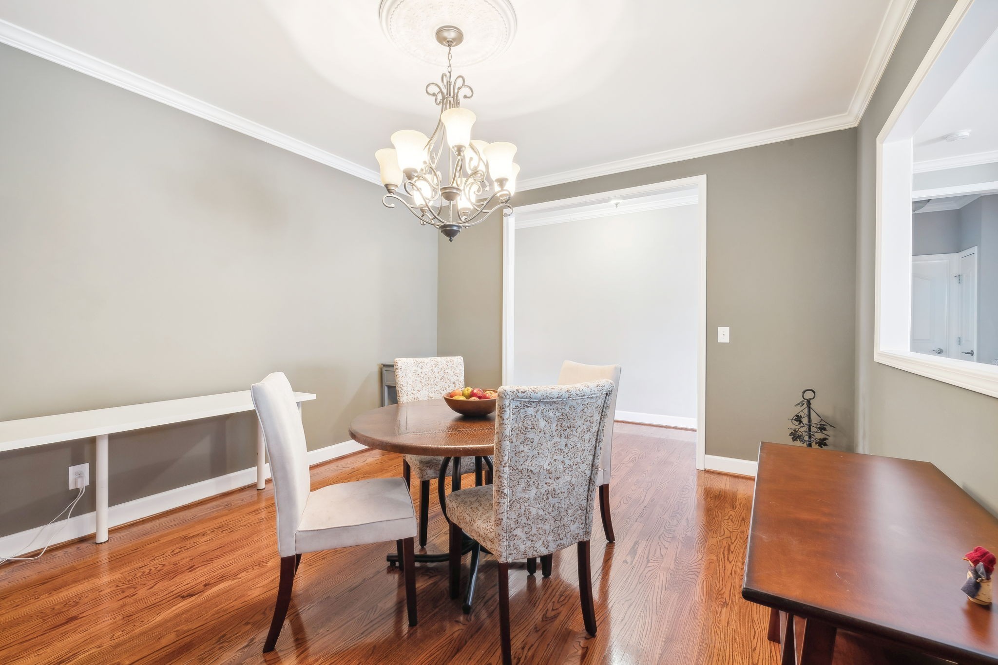 7126 Fernvale Springs Way Fairview, TN 37062 - Photo 12 of 35 a view of a dining room with furniture a chandelier and wooden floor